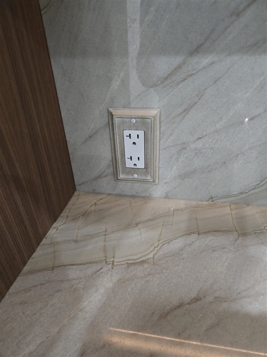 Custom outlet installed on marble wall